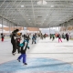 daytime image of a group of people skating at Jim Tubman Chevrolet Rink