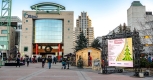 City hall building outside with people enjoying Christmas event