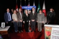 Mayor and guests standing in front of street sign with name Roger Griffiths Avenue