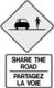 Panneau indiquant que les cyclistes et les véhicules motorisés doivent "partagez la voie"