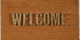 A welcome mat with the word welcome spelled out in porcupine quills facing upward.