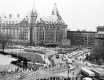 View of streetcars, marching band, and spectators in the streetcar parade