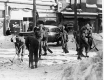 Men clearing streetcar rails from snow with shovels