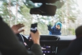 View from inside a car of driver texting and about to hit a female pedestrian/Vue de l’intérieur d’une voiture d’un conducteur qui envoie des textos et qui s’apprête à heurter une piétonne