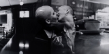 Double exposure black and white photograph of two people kissing