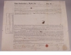 A close-up of an 1833 legal document with pen and ink signed details.