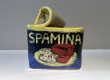 This glazed ceramic sculpture humorously depicts a can of Spam labeled "spamina" with an image of the canned meat.