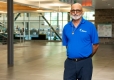 Vijay Gupta standing in the lobby near the weight and cardio room.