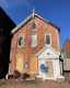 Heritage brick house with graffiti at 127 York Street.