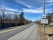 Image of sign signalling load restrictions on a road.