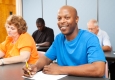 adult sitting in a classroom