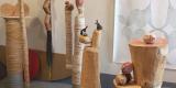 tall totem-like sculptures of varying heights fill up the artist’s studio space 