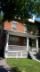 This red brick house with a covered front porch is located in the Lowertown West Heritage Conservation District. 