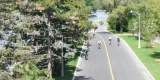 Cyclists riding on a path next to the Rideau Canal