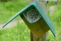  Bee hotel made out of milk cartons and rolls of scrap paper