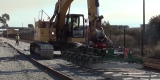 Machine installing rail ties