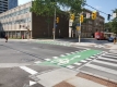 This is a photo showing the new cycle track open and cycle signal heads activated.