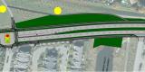vue aérienne du chantier de construction montrant les routes, les stationnements et deux points jaunes qui pointent vers des sites d’art public 