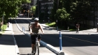 A cyclist using the segregated bike lane on Laurier Avenue