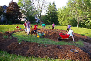 Neighbouring community and school children build garden
